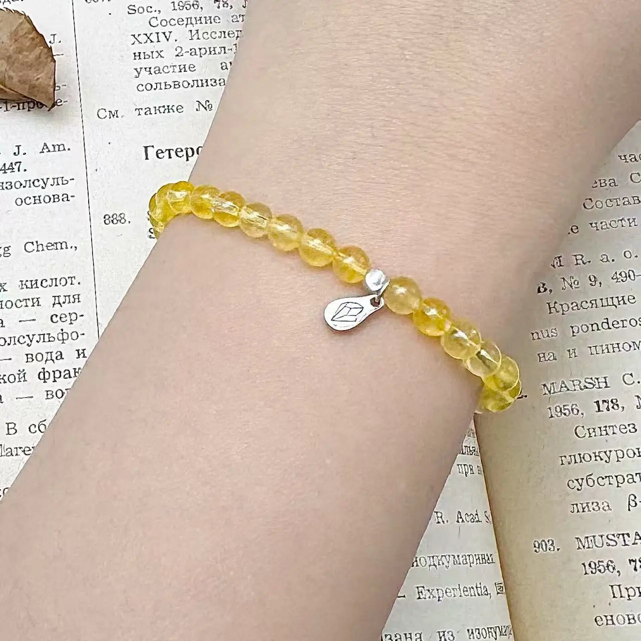 Citrine bracelet on wrist with warm yellow glow for confidence and abundance