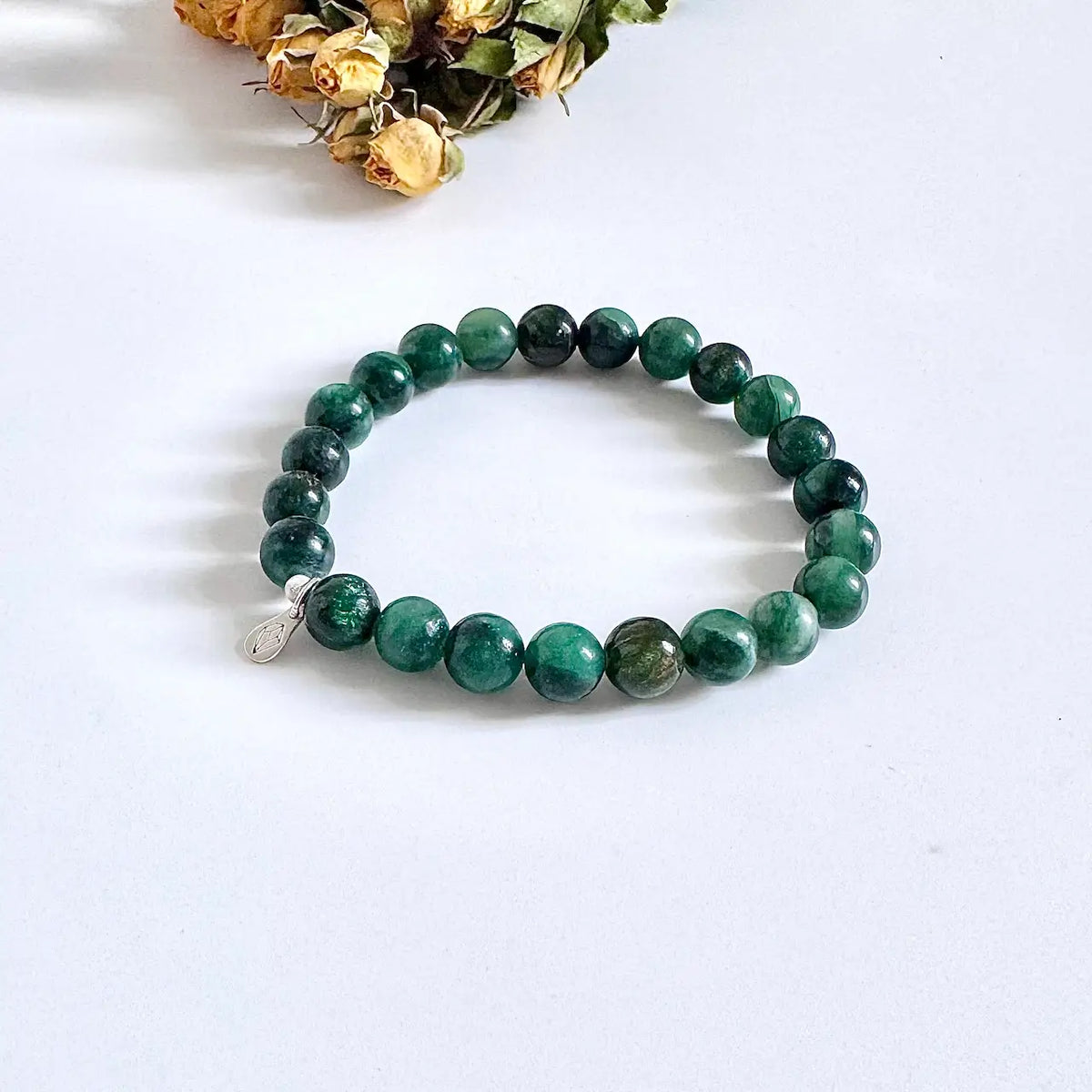 Emerald green crystal bracelet with polished round beads