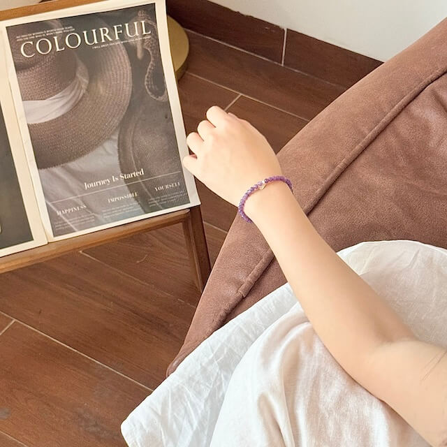 lepidorite bracelet on the hand