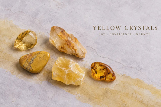 Yellow crystals including citrine, yellow jasper, golden healer quartz, yellow calcite and amber