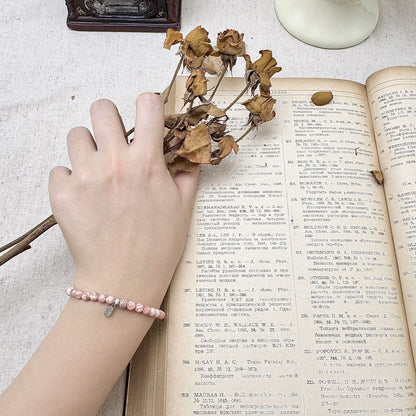 4mm rhodochrosite crystal bracelet on the hand