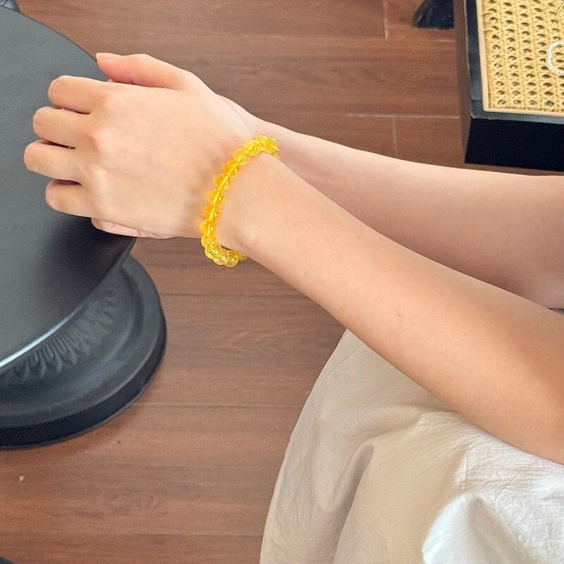 Citrine bracelet on wrist for confidence, abundance, and radiant energy