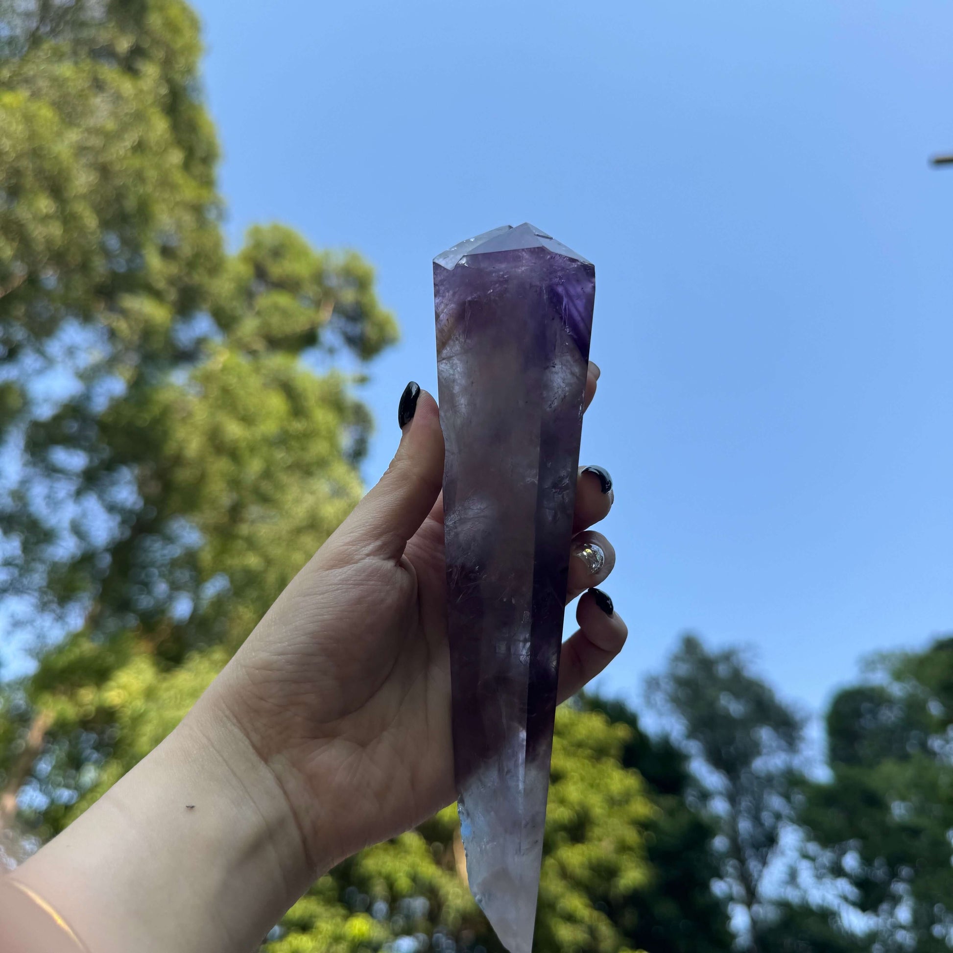 Polished Amethyst Scepter held in hand