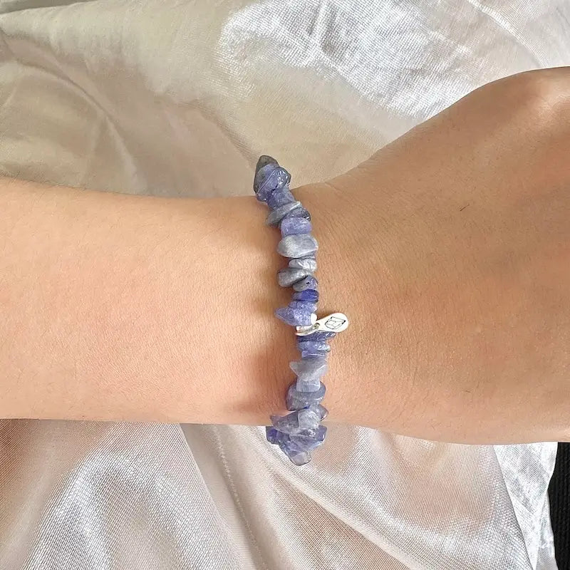 Purple tanzanite bracelet worn on wrist showing natural crystal healing jewelry style