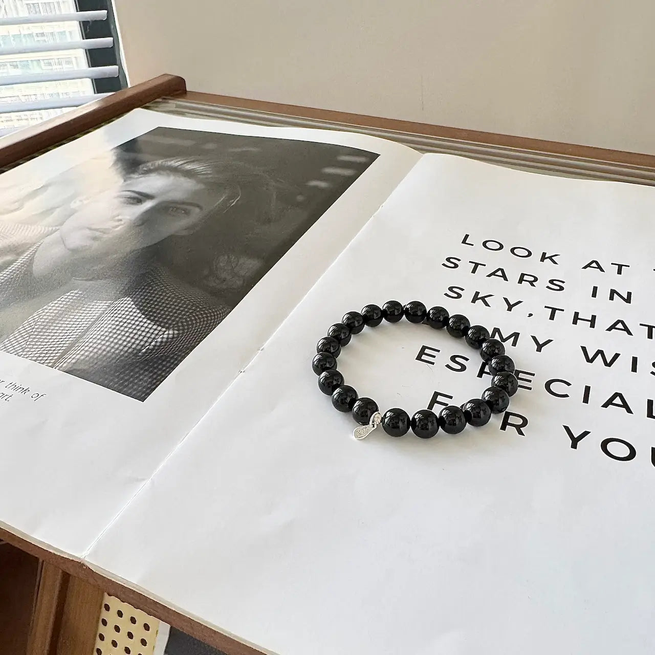 Close-up of black tourmaline crystal bracelet showing natural polished bead detail
