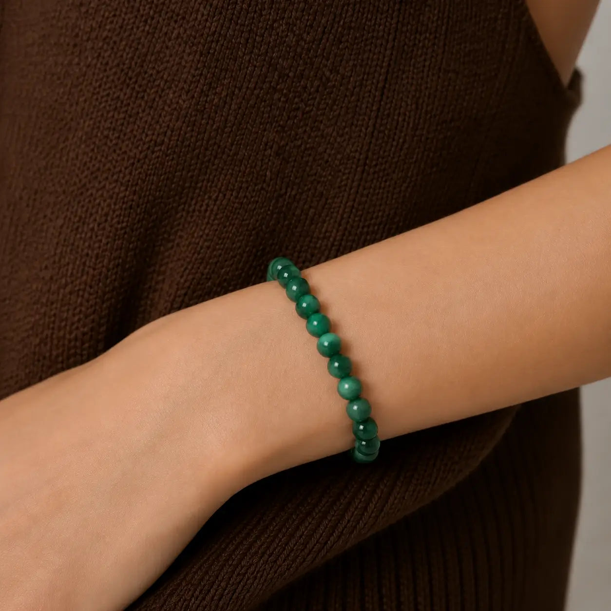 Emerald Bead bracelet worn on wrist for attracting love and heart chakra healing