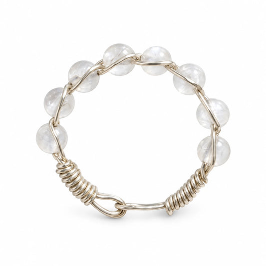 Moonstone beaded wire-wrapped ring on a white background