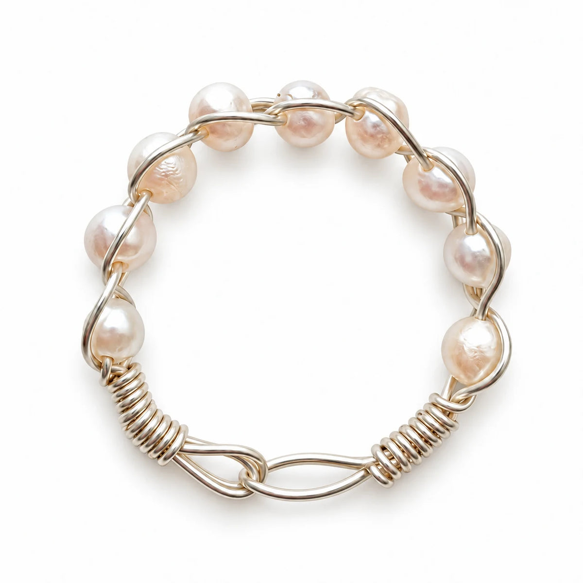 Creamy white pearl ring with gently curved wire wrapping on a white background