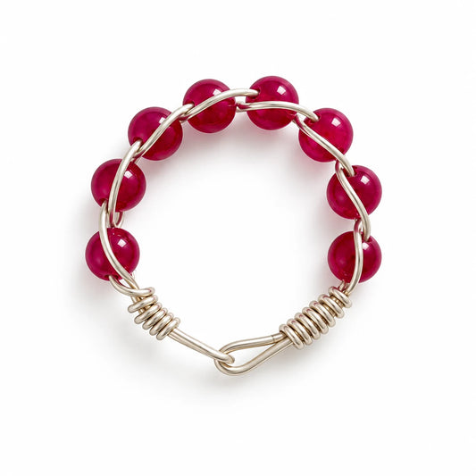 Ruby beaded wire-wrapped ring on a white background